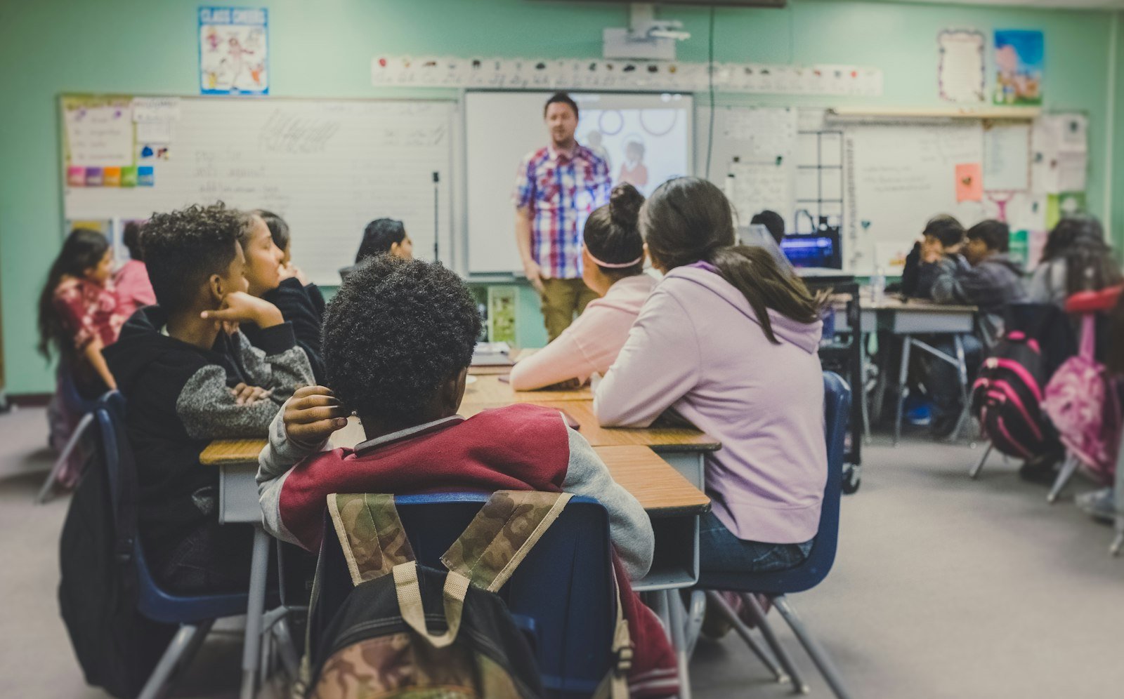 A teacher leading a lively class
